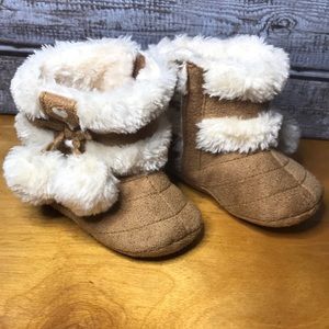 Sweet little girl moccasin boots with hearts and dangling puff balls